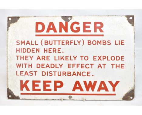 A mid-20th century enamelled butterfly bomb danger sign, 30.5 x 45.5cm.Additional InformationLoses to the enamel on all corne