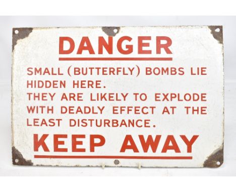 A mid-20th century enamelled butterfly bomb danger sign, 30.5 x 45.5cm.Additional InformationLoses to the enamel on all corne