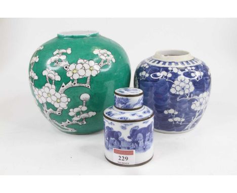 A Chinese green and white glazed porcelain ginger jar, in the prunus pattern, h.17cm; together with another similar; and a Ch