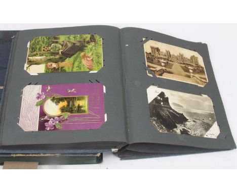 Two albums of vintage postcards, to include architectural, topographical and novelty examples 