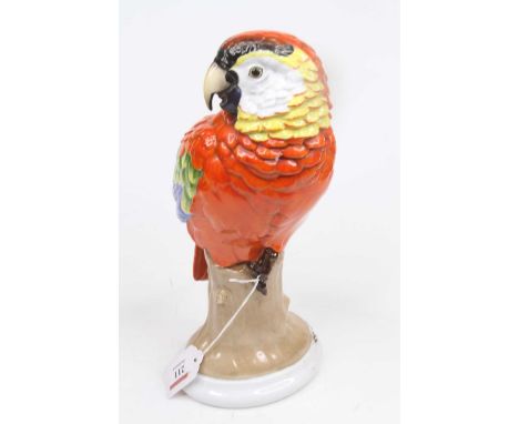 A Rosenthal porcelain model of a parrot, shown seated upon a stump, h.29cmTip of tail broken.Otherwise good.