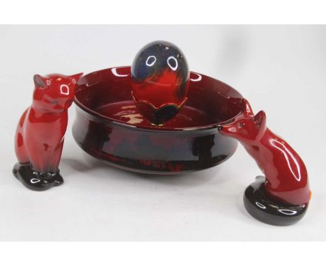 A collection of Royal Doulton flambe wares, to include a model of a cat, h.13cm; a model of a fox, h.12cm; an eggcup with egg