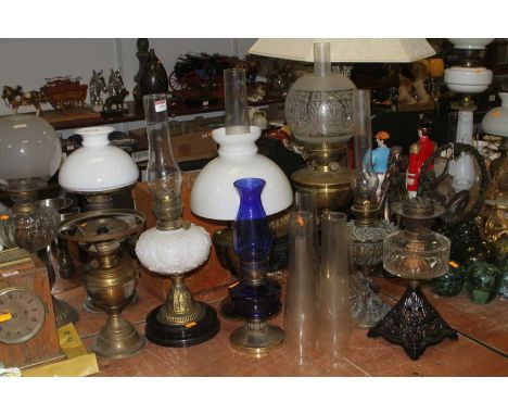 A late 19th century oil lamp, having acid etched clear and frosted shade, over a Hinks No.2 Duplex bayonet fit burner, brass 