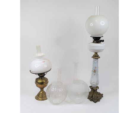 A late 19th century oil lamp, having opaline glass shade above Duplex bayonet burner and opaline glass reservoir, the brass m