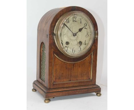 A mid-19th century mahogany cased dome topped mantel clock, the silvered dial showing Arabic markers and twin winding holes f