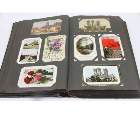 An album of vintage postcards, to include portrait, architectural and topographical examples 
