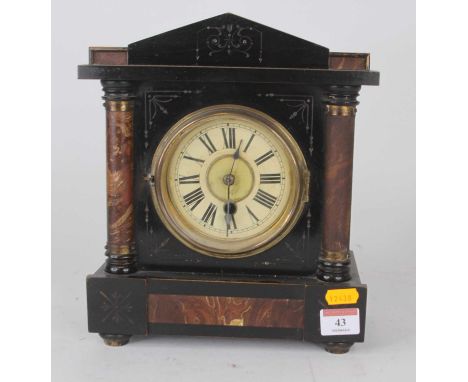 An early 20th century American simulated slate and marble mantel clock, the painted chapter ring showing Roman numeral marker