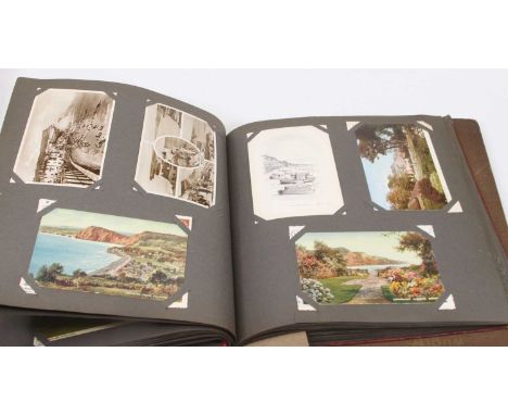 Two vintage postcard albums and contents, to include portrait, topographical and novelty examples 