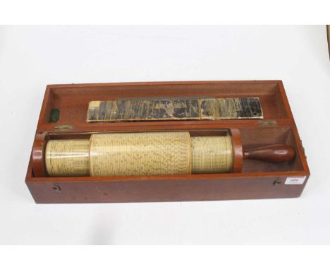 A vintage Fuller spiral slide rule, housed in wooden case, 42cm; together with another rule (2)The smaller rule made in Bavar