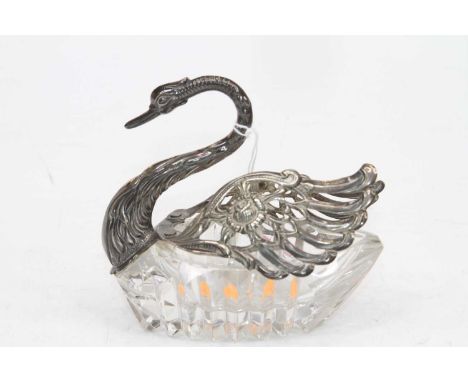 A continental silver mounted cut glass open salt in the form of a swan, having hinged wings opening to reveal the basin, h.10