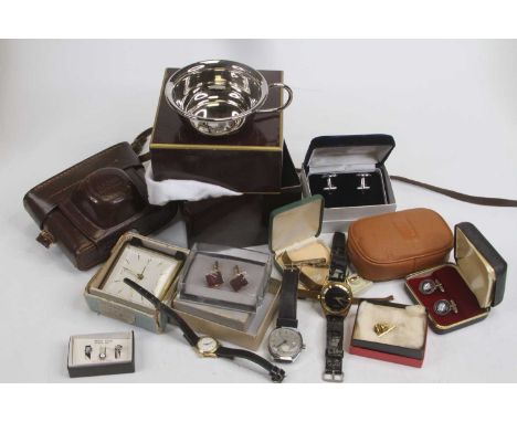 A collection of miscellaneous items, to include a mantel clock, vintage SLR camera, wristwatches, silver tie-clip etc 