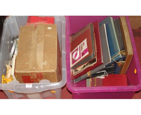 A vintage film projector and accessories; together with vintage postcard and photograph albums
