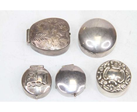 A collection of five silver and white metal pill and patch boxes