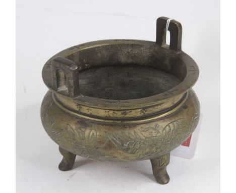 A Chinese brass tripod censer, decorated with a phoenix, dia.12cmIn our opinion this is a copy, some age wear