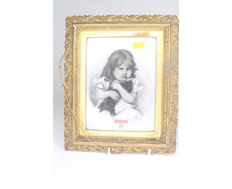 Late 19th century English school - portrait of a young girl holding a kitten, charcoal on porcelain, 18.5 x 14cm 