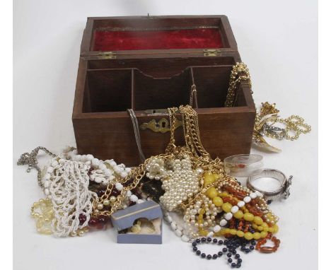 A George III mahogany tea caddy, containing a collection of beaded necklaces 
