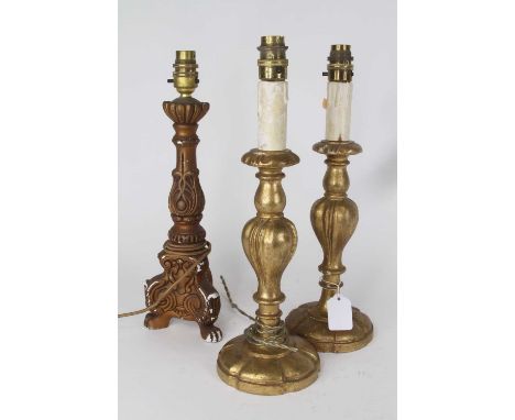 A pair of giltwood table lamps in the 18th century style, h.37cm; together with a gilt painted Rococo style table lamp (3)