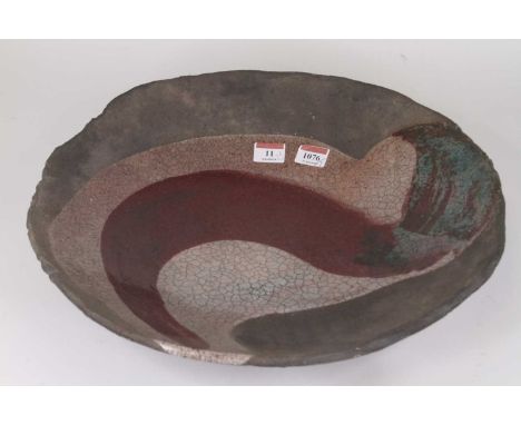 Christa Maria Herrmann (b. 1945) - A large ceramic Raku bowl, of shallow form, crackle glazed with band of colour to centre, 