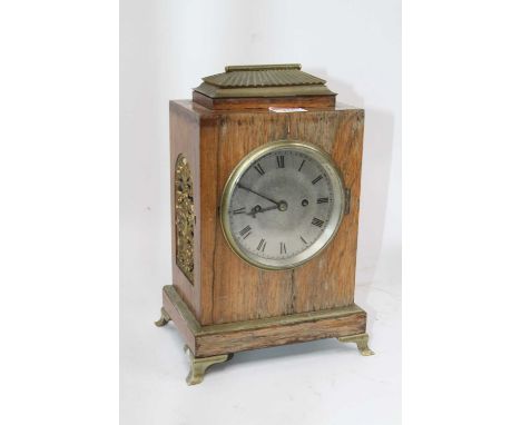 A George IV rosewood cased mantel clock, of rectangular shape, the silvered dial with Roman numeral markers and twin winding 