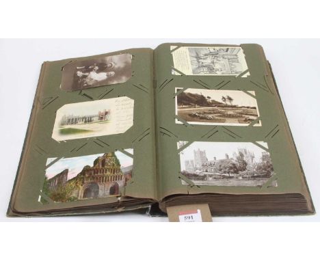 A vintage postcard album and contents, primarily topographical and architectural 