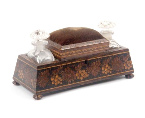 A Tunbridge ware dressing table box, of rectangular form raised on four stick ware bun feet, the sloping sides with a broad b