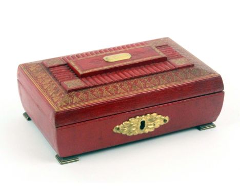 A red leather and gilt tooled small format sewing box, circa 1800, in a remarkable state of preservation, of sarcophagol form