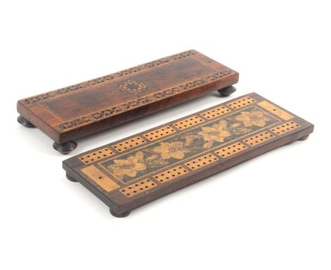 Two Tunbridge ware cribbage boards, comprising a rosewood example raised on bun feet with a central broad band of floral mosa