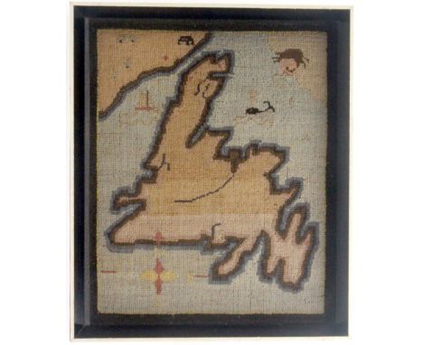 An interesting primitive 19th Century tapestry map of Newfoundland, with compass, whale, sailing boat and a face blowing wind