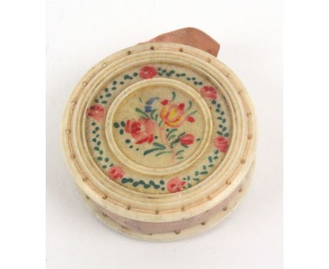A painted bone disc form pin cushion, one side painted with flowers and inscribed 'A Gift From Ryde I.W.', the reverse with f
