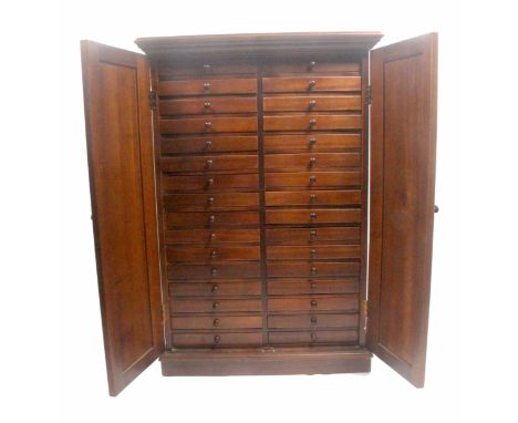 A 20th Century craftsman made Victorian style walnut collectors cabinet, enclosed by a pair of panel doors flanked by reeded 