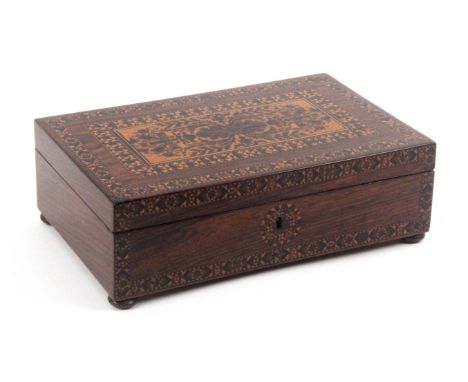 A Tunbridge ware rosewood box, of rectangular form, the front with a stick ware border and circular escutcheon, the lid with 