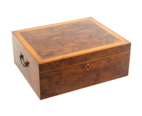 A large George III yew wood sewing box, circa 1790, of rectangular form, brass side carrying handles, the lid with a satinwoo