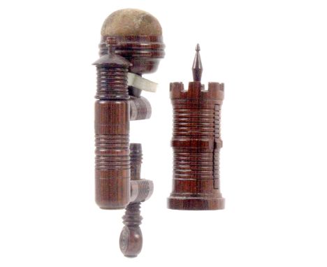 A rosewood needle flannel roll and a sewing clamp, the first in the form of a crenulated turret with spire form winder, 8cms 