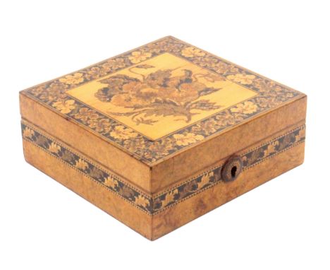 A Tunbridge ware burr walnut box of square form, the sides with a narrow band of leaf mosaic, the front with button form mosa
