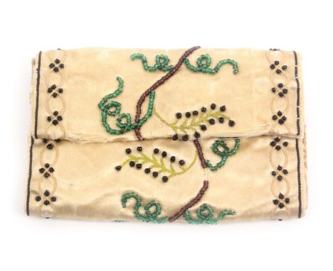 A cream silk hussif, circa 1830, worked with trailing branches in coloured beads within beadwork and embroidered borders, the