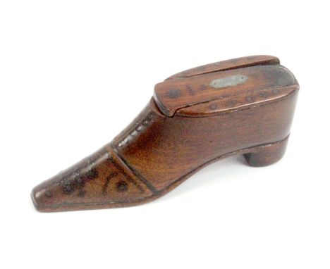 An early 19th Century mahogany snuff box in the form of a shoe, with brass pin decoration to the sole, toe cap and lace holes