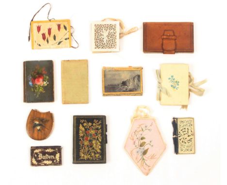 Ten needle books and two note books, comprising a diamond form silk example painted with flowers, 10cms, another painted silk