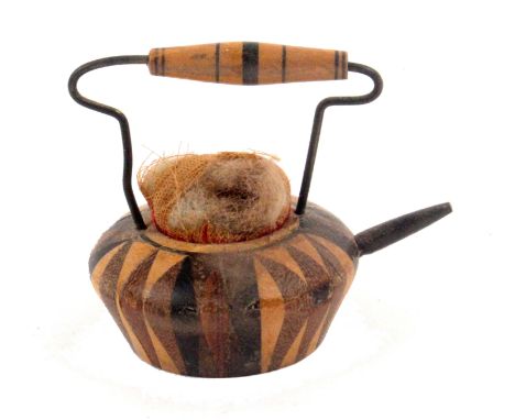 A Tunbridge ware tea kettle pin cushion emery labelled for Medhurst's, of typical form, the stick ware body with rosewood spo