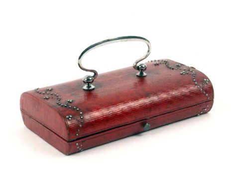 A fine Palais Royal red leather cased small format sewing box, circa 1810, of near oval section and rectangular form, the lid