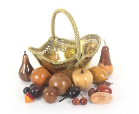 A polished brass decorative basket, 26cms, a collection of modern treen fruit, a brass oval tea caddy and a pair of Bakelite 
