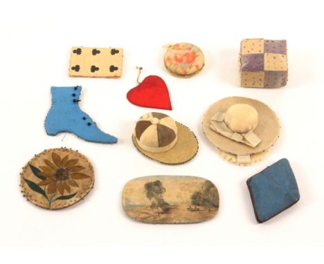 Ten material pin cushions, including a jockey cap, 5.5cms, a lady's hat with pin flannels, 6.3cms, six card form examples inc