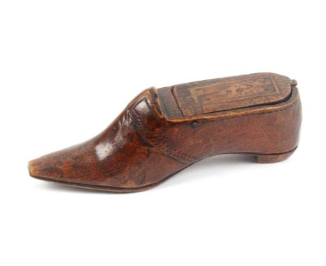 An early 19th Century fruitwood snuff box in the form of a shoe, dot 'stitch' decoration, the pin hinge lid with inlaid diamo