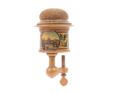 An early Tunbridge ware whitewood paint and print decorated sewing clamp, the turned frame below a circular box painted with 