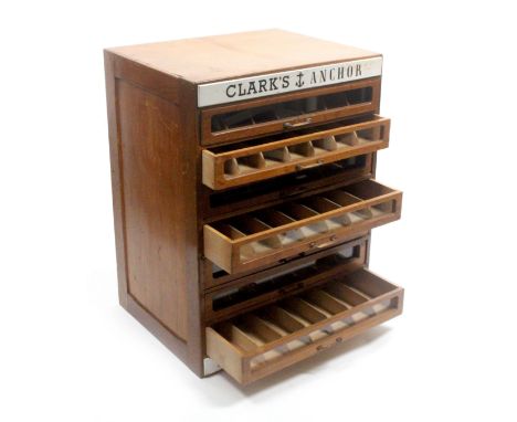 A 'Clark's Anchor' oak and stained wood seven drawer double sided counter display chest, the customer side with two black on 