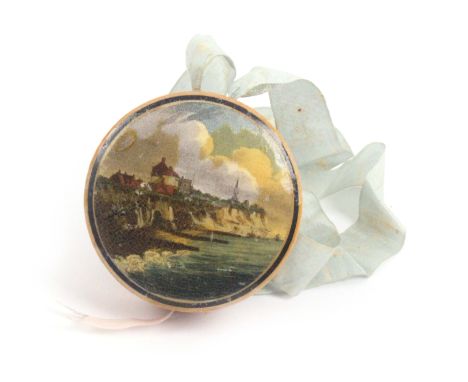 An early Tunbridge ware white wood paint and print decorated combination pin cushion and tape measure, on original blue silk 