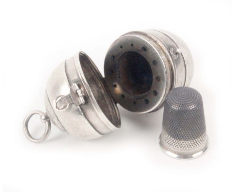 A silver egg form sewing companion, 1793, hinged clasp, ring top mount, the interior with a later silver thimble within a bor