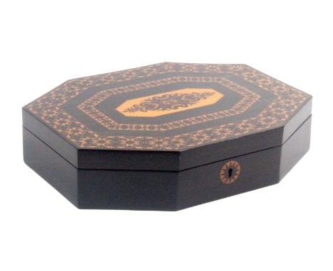 An ebony Tunbridge ware games box by Edmund Nye, of octagonal form with star form circular escutcheon, the lid with an inset 