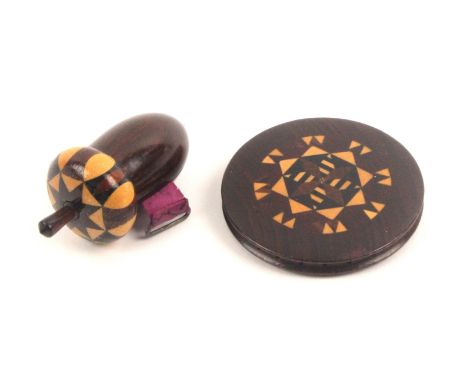 A Tunbridge ware tape measure by Edmund Nye and a Tunbridge ware pin wheel, the tape measure of acorn form in rosewood with s