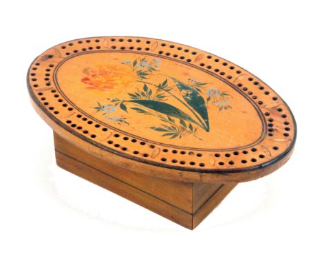 An early Tunbridge ware white wood painted and inlaid oval cribbage board, the centre painted with a flower spray in the Spa 