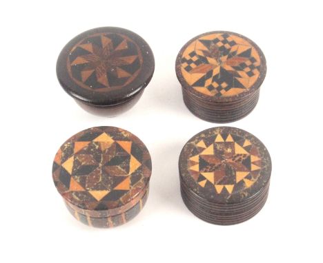 Four small Tunbridge ware circular boxes, comprising two rib turned counter boxes with stick ware tops, 3 and 3.2cms dia., a 